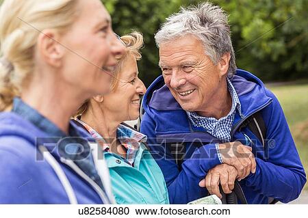Group of friends, outdoors, smiling View Large Photo Image Stock Image - Group of friends, outdoors, smiling. Fotosearch