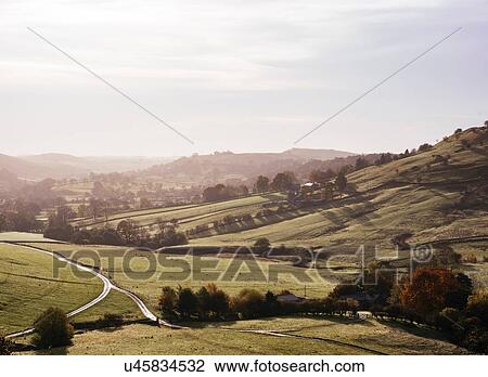Stock Image - High angle view of rolling farming landscape, Peak District, Derbyshire, England, UK. Fotosearch