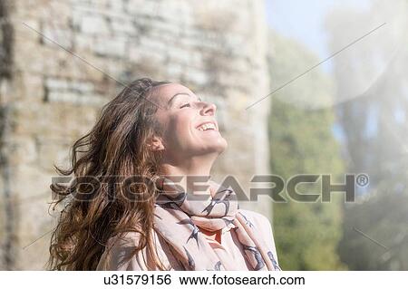 Portrait of carefree woman at Thornbury Castle, South Gloucestershire, UK View Large Photo Image Stock Photograph - Portrait of carefree woman at Thornbury Castle, South Gloucestershire, UK. Fotosearch