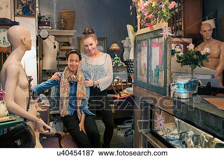 Portrait of two female colleagues in vintage shop View Large Photo Image Stock Photo - Portrait of two female colleagues in vintage shop. Fotosearch