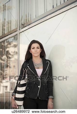 Stock Image - Portrait of woman, outdoors. Fotosearch