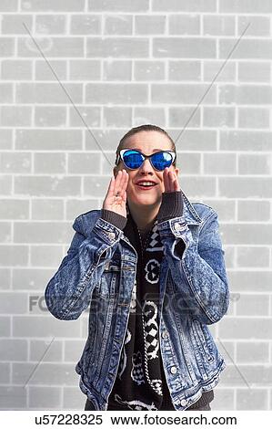 Portrait of young woman, outdoors, shouting View Large Photo Image Stock Photography - Portrait of young woman, outdoors, shouting. Fotosearch