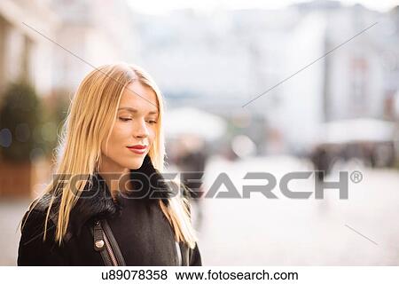 Portrait of young woman with long blond hair, Covent Garden, London, UK View Large Photo Image Stock Photo - Portrait of young woman with long blond hair, Covent Garden, London, UK. Fotosearch