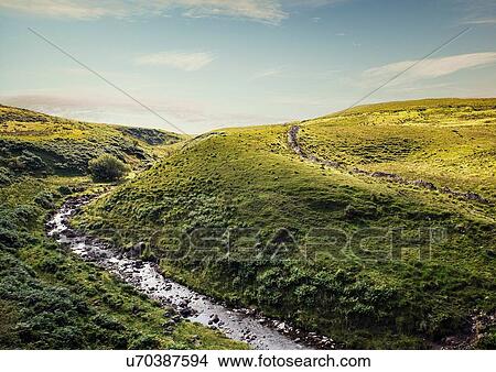 Picture - River flowing through rolling landscape, Brecon Beacons, Wales, UK. Fotosearch