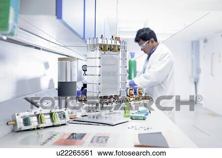 Scientist assembles lithium ion battery samples in battery research facility View Large Photo Image Stock Image - Scientist assembles lithium ion battery samples in battery research facility. Fotosearch