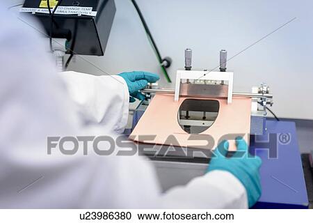 Scientist making lithium ion battery samples in battery research facility, close up View Large Photo Image Stock Image - Scientist making lithium ion battery samples in battery research facility, close up. Fotosearch