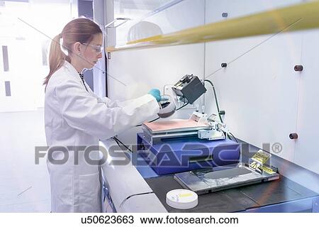 Scientist making lithium ion battery samples in battery research facility View Large Photo Image Stock Image - Scientist making lithium ion battery samples in battery research facility. Fotosearch