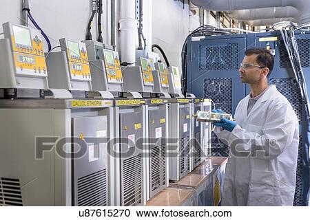 Scientist with lithium ion battery aging equipment in battery research facility View Large Photo Image Stock Image - Scientist with lithium ion battery aging equipment in battery research facility. Fotosearch
