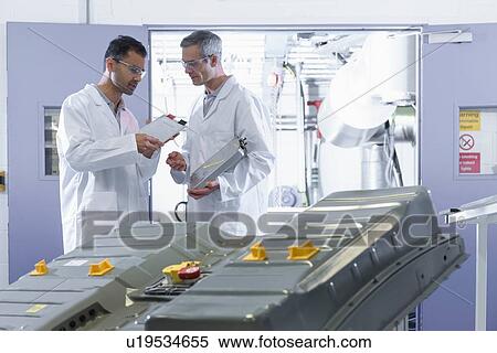 Scientists inspecting lithium ion car battery components in battery research facility View Large Photo Image Stock Photography - Scientists inspecting lithium ion car battery components in battery research facility. Fotosearch