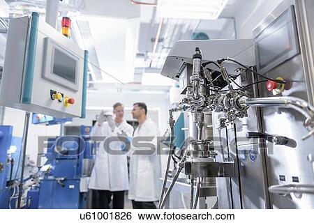 Scientists with lithium ion battery production line in battery research facility View Large Photo Image Stock Photograph - Scientists with lithium ion battery production line in battery research facility. Fotosearch