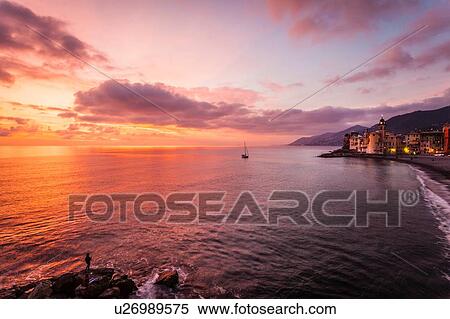 Stock Photography - Silhouetted beach at dusk, Camogli, Liguria, Italy. Fotosearch