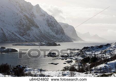 Snow covered mountains and fjord near Unstad, Lofoten Islands, Norway View Large Photo Image Stock Image - Snow covered mountains and fjord near Unstad, Lofoten Islands, Norway. Fotosearch
