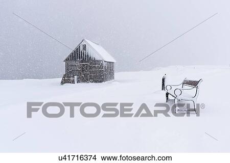Picture - Snow covered shed and park bench, Seltjarnarnes, Iceland. Fotosearch