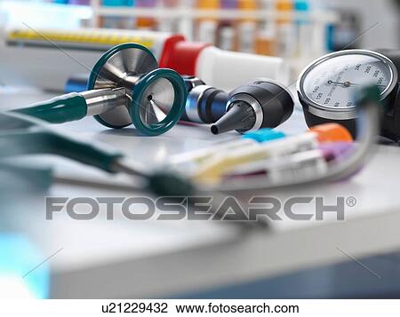 Stethoscope, auriscope, blood pressure gauge on desk View Large Photo Image Stock Image - Stethoscope, auriscope, blood pressure gauge on desk. Fotosearch