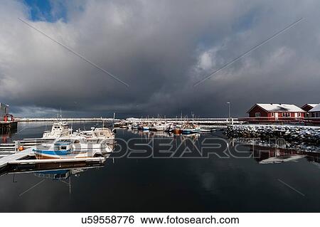 Stock Photograph - Storm clouds over waterfront at Andenes, Vesteralen Islands, Norway. Fotosearch