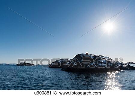 Stock Photo - Sunlit rocky island, Svolvaer, Lofoten Islands, Norway. Fotosearch