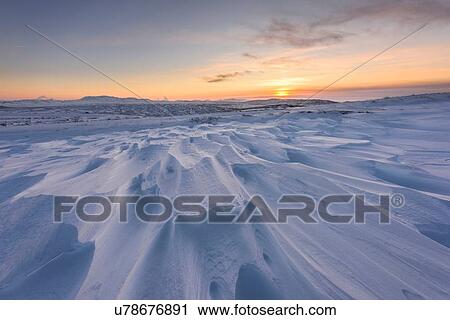 Windswept snow covered field at sunset, Skalafell, Iceland View Large Photo Image Stock Image - Windswept snow covered field at sunset, Skalafell, Iceland. Fotosearch