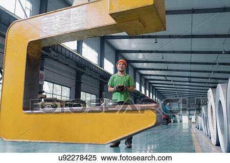 Stock Photography - Worker in solar panel assembly factory, Solar Valley, Dezhou, China. Fotosearch