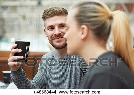 Picture - Young couple at cafe, drinking coffee. Fotosearch
