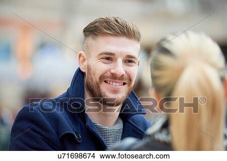 Young couple face to face, outdoors View Large Photo Image Picture - Young couple face to face, outdoors. Fotosearch