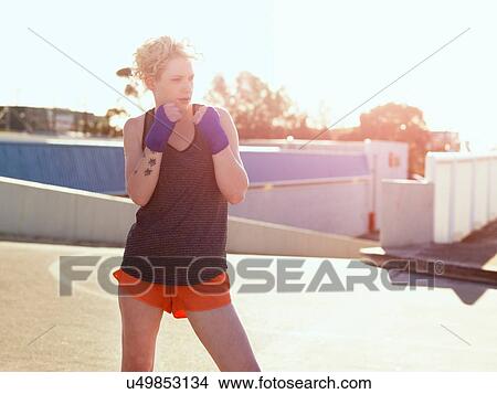 Young female boxer training in parking lot View Large Photo Image Picture - Young female boxer training in parking lot. Fotosearch