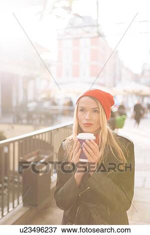 Young women with takeaway coffee, Covent Garden, London, UK View Large Photo Image Stock Photo - Young women with takeaway coffee, Covent Garden, London, UK. Fotosearch