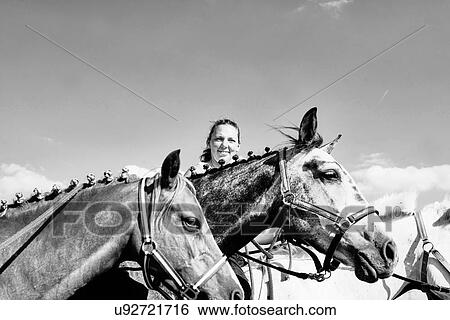 B & W image of woman with horses View Large Photo Image Stock Photograph - B & W image of woman with horses. Fotosearch