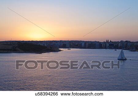 Boat on water at dusk, Valletta, Malta View Large Photo Image Stock Photograph - Boat on water at dusk, Valletta, Malta. Fotosearch