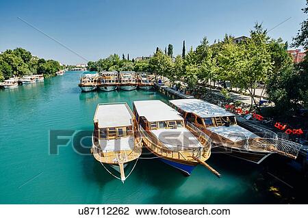 Boats moored at river waterfront, Antalya, Turkey View Large Photo Image Stock Image - Boats moored at river waterfront, Antalya, Turkey. Fotosearch