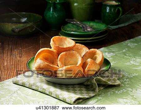 Bowl of yorkshire pudding with green colour pottery View Large Photo Image Stock Photo - Bowl of yorkshire pudding with green colour pottery. Fotosearch