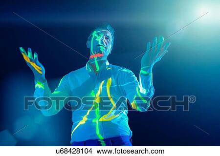 Businessman making presentation with projected graphical financial data View Large Photo Image Picture - Businessman making presentation with projected graphical financial data. Fotosearch