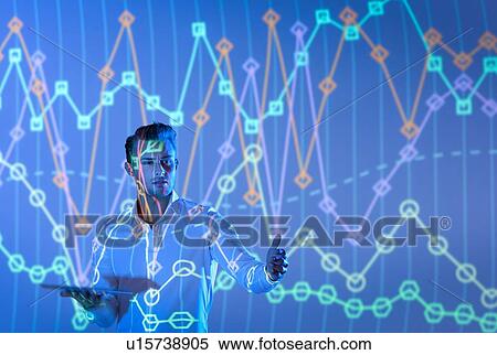 Stock Photography - Businessman making presentation with graphical projected images. Fotosearch