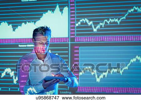 Businessman using digital tablet and making presentation with graphical projected images View Large Photo Image Stock Photo - Businessman using digital tablet and making presentation with graphical projected images. Fotosearch
