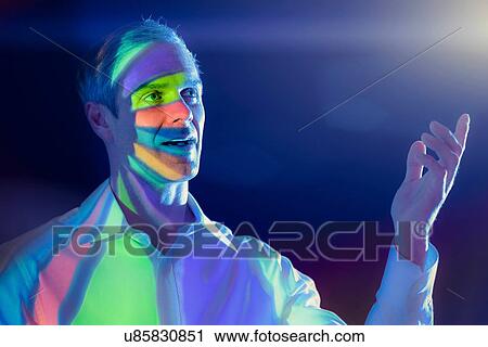 Businessman with projected financial data View Large Photo Image Stock Image - Businessman with projected financial data. Fotosearch
