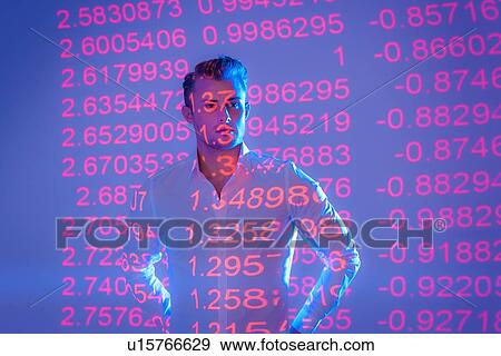 Stock Photo - Businessman with projected financial data. Fotosearch