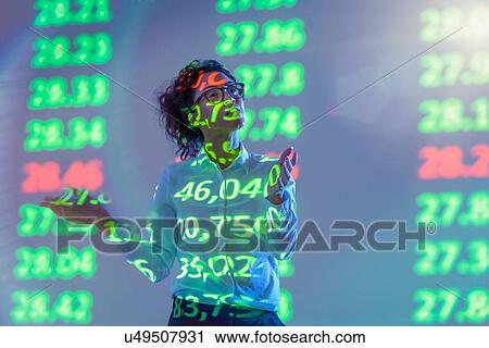 Businesswoman making presentation with graphical financial data projection View Large Photo Image Stock Image - Businesswoman making presentation with graphical financial data projection. Fotosearch