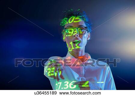Businesswoman making presentation with graphical financial data projection, portrait View Large Photo Image Stock Photo - Businesswoman making presentation with graphical financial data projection, portrait. Fotosearch