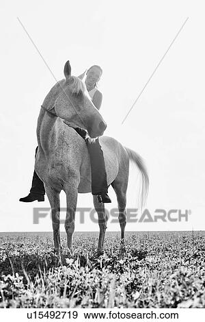 B&W portrait of woman riding horse bareback in field View Large Photo Image Stock Photo - B&W portrait of woman riding horse bareback in field. Fotosearch