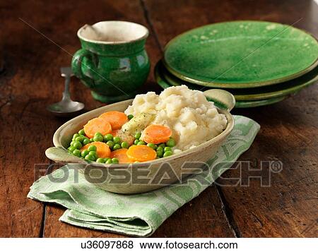 Carrots and peas with mashed potato in oval dish View Large Photo Image Stock Photo - Carrots and peas with mashed potato in oval dish. Fotosearch