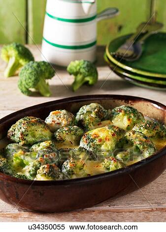 Casserole side dish with broccoli gratin and cheese View Large Photo Image Stock Photography - Casserole side dish with broccoli gratin and cheese. Fotosearch