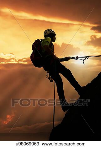 Climber on rocky wall at sunset, Mont Blanc, France View Large Photo Image Stock Photo - Climber on rocky wall at sunset, Mont Blanc, France. Fotosearch