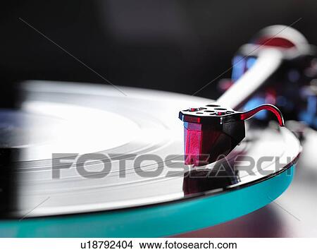 Picture - Close up of a vinyl record and stylus on turntable. Fotosearch