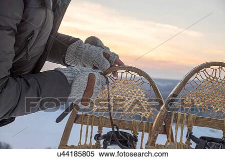 Close up of mans gloved hands preparing snow shoes, Ural, Russia View Large Photo Image Stock Photography - Close up of mans gloved hands preparing snow shoes, Ural, Russia. Fotosearch