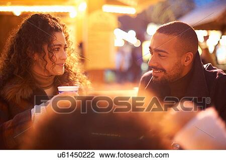 Couple at amusement park with daughter face to face smiling View Large Photo Image Stock Image - Couple at amusement park with daughter face to face smiling. Fotosearch