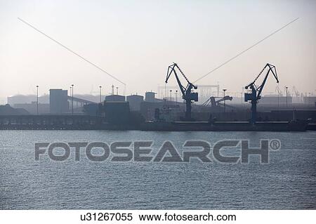 Stock Photography - Cranes and containers at port. Fotosearch