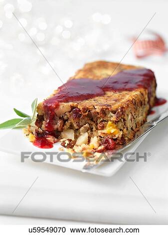 Stock Image - Date and cranberry roast with mulled wine jus. Fotosearch