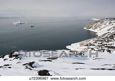 Elevated view of snow covered coast and Disko Bay at Ilulissat, Greenland View Large Photo Image Stock Photo - Elevated view of snow covered coast and Disko Bay at Ilulissat, Greenland. Fotosearch