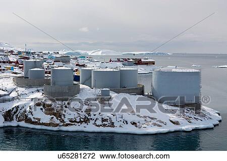 Stock Image - Elevated view of snow covered oil tanks at Ilulissat, Greenland. Fotosearch