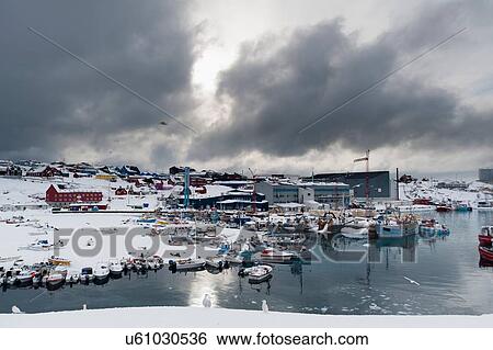 Stock Photograph - Elevated view of storm clouds over harbour, Ilulissat, Greenland. Fotosearch