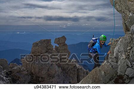 Female climber on rocky wall at sunset, Mont Blanc, France View Large Photo Image Stock Image - Female climber on rocky wall at sunset, Mont Blanc, France. Fotosearch